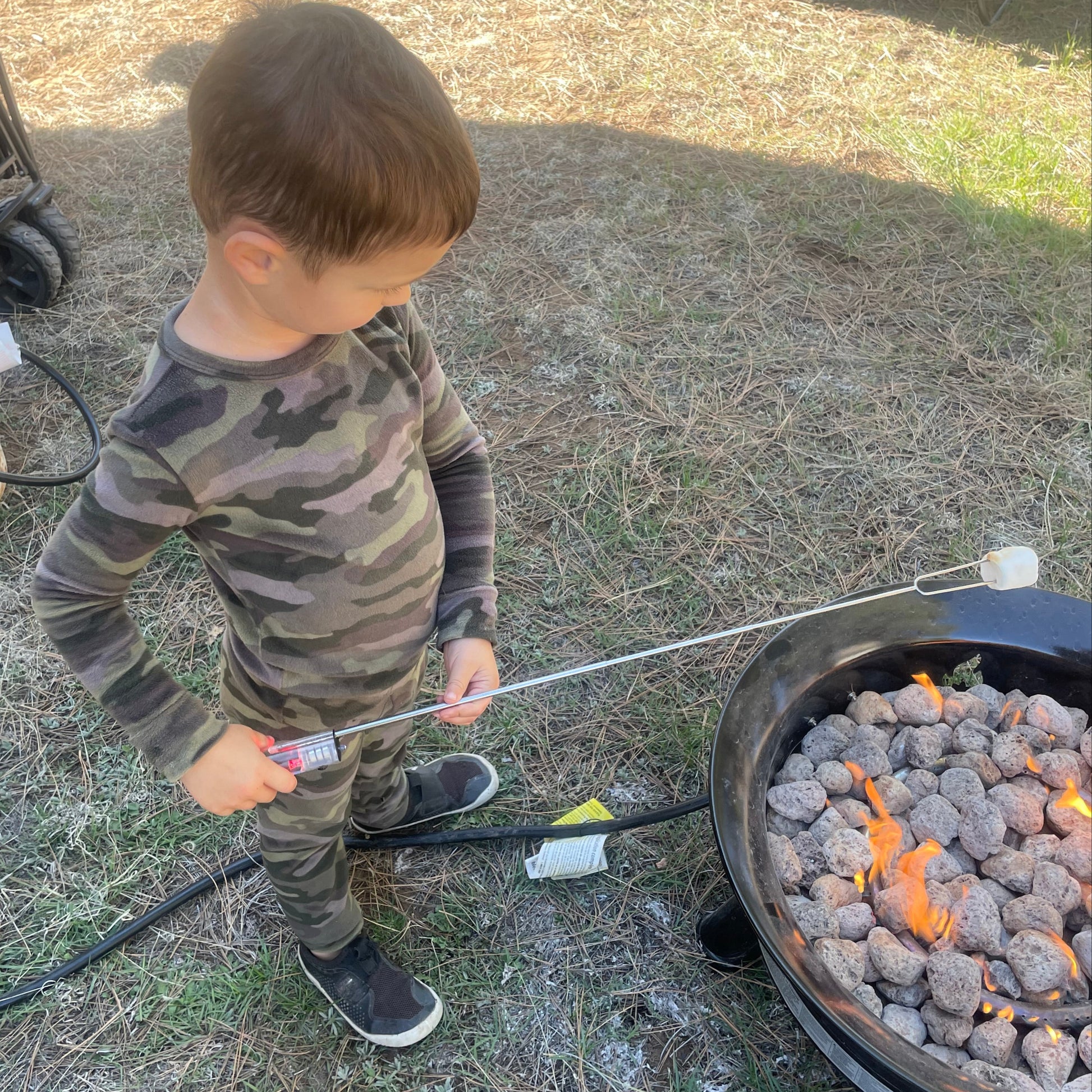 LIttle Boy roasting marshmallow with Light Pal 